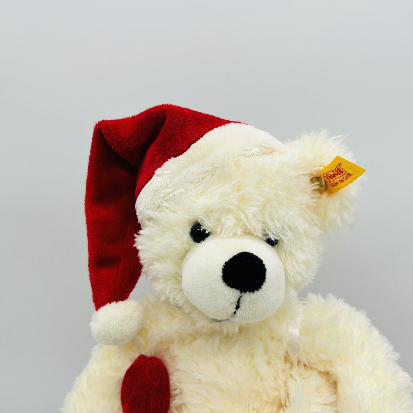 Steiff 111525 Teddybär Weihnachten mit Zuckerstange im Strumpf 28 cm