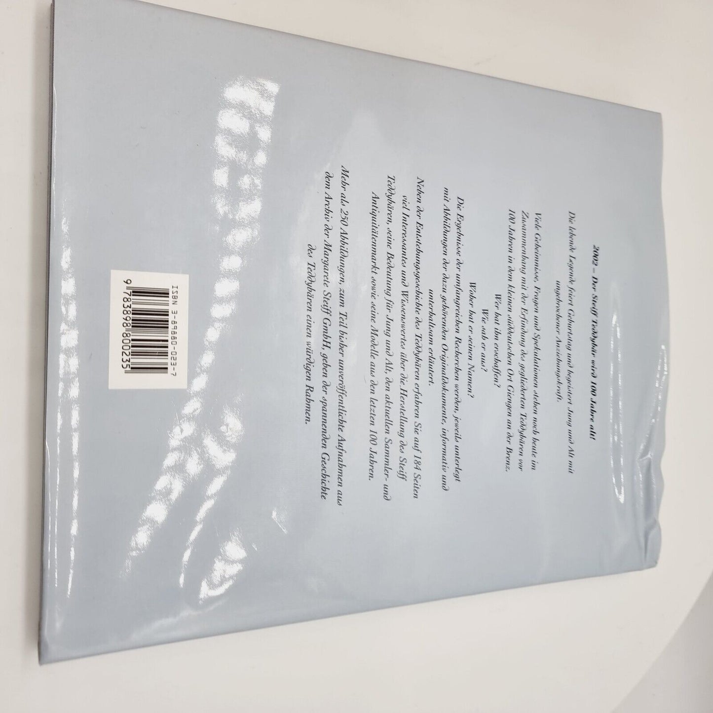 Steiff 038891 Teddybär mit Buch 25 cm 100 Jahre Steiff mit Zertifikat Jahr 2002