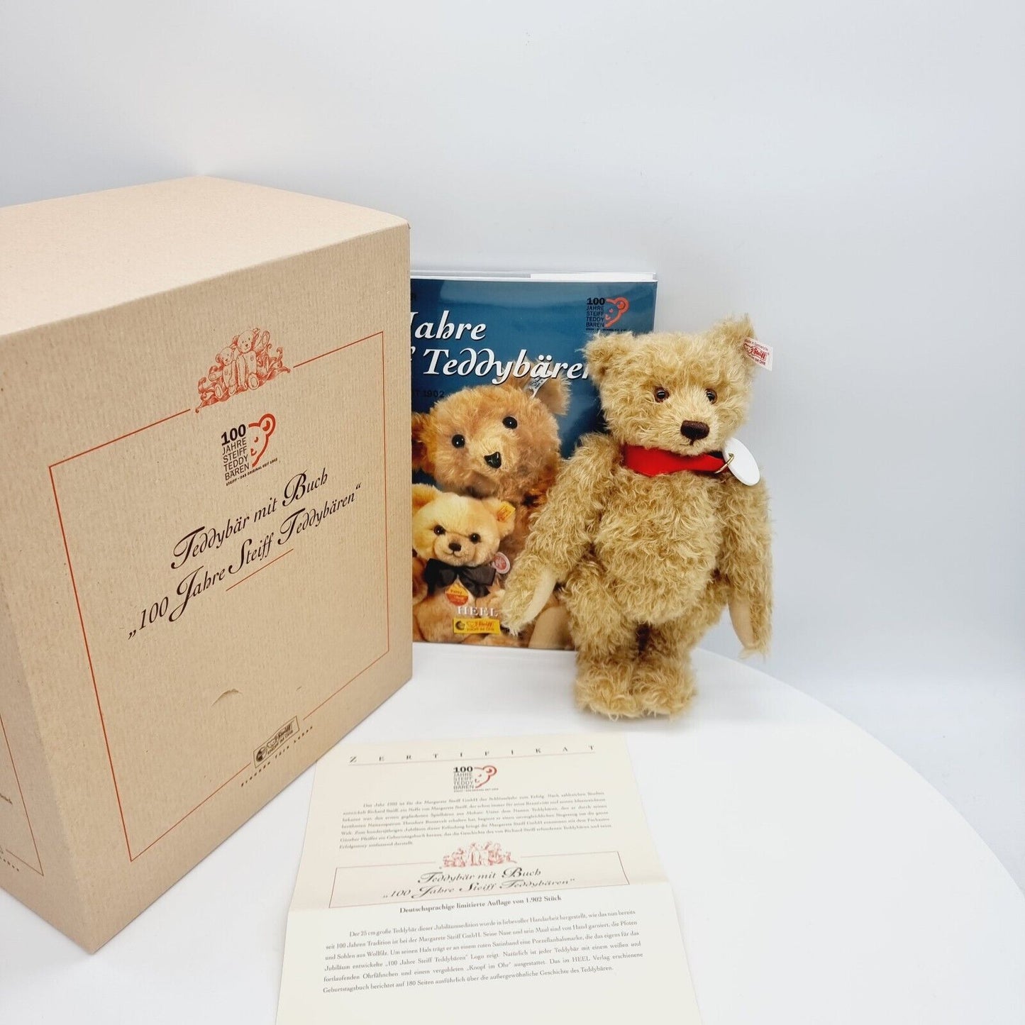 Steiff 038891 Teddybär mit Buch 25 cm 100 Jahre Steiff mit Zertifikat Jahr 2002