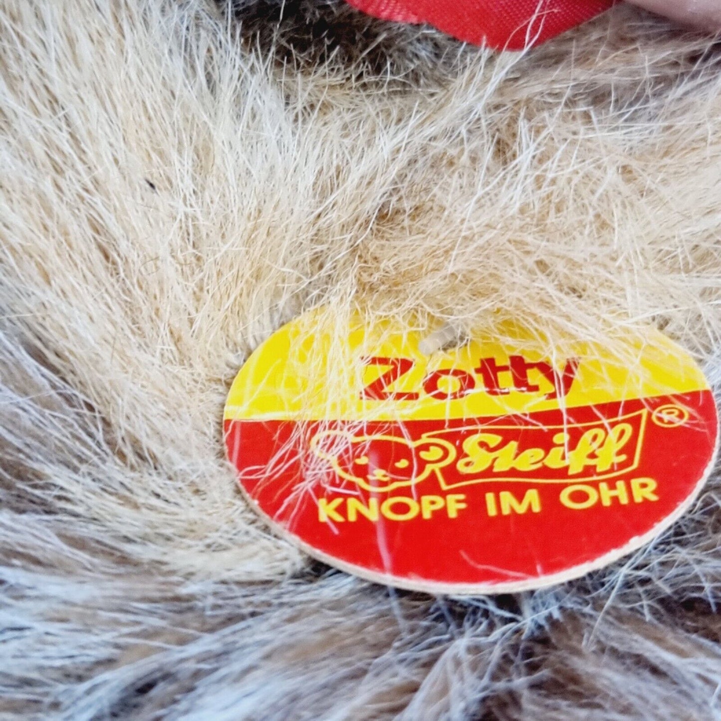 Steiff Teddybär Zotty 018107 30 cm grau-braun mit roter Schleife