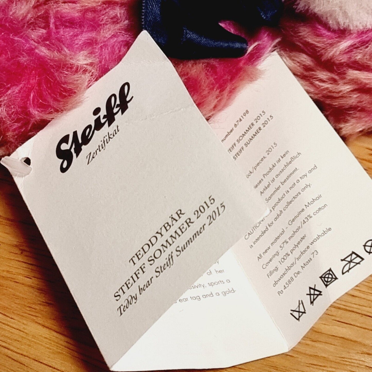 Steiff 674198 Teddybär Steiff Sommer 2015 mit schwarzer Schleife pink 20 cm