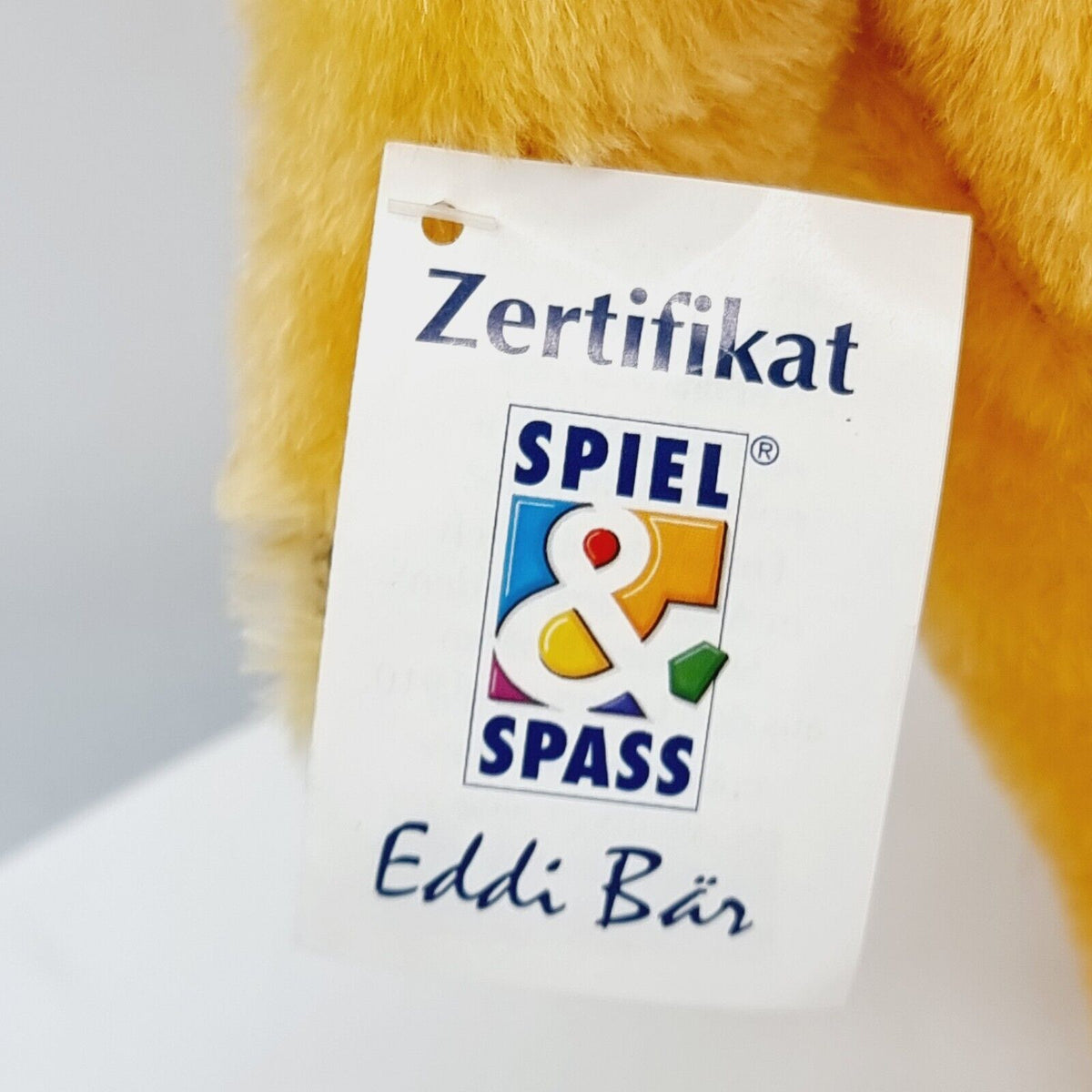 Steiff 650925 Teddybär Eddi Spiel und Spaß mit blauer Schleife