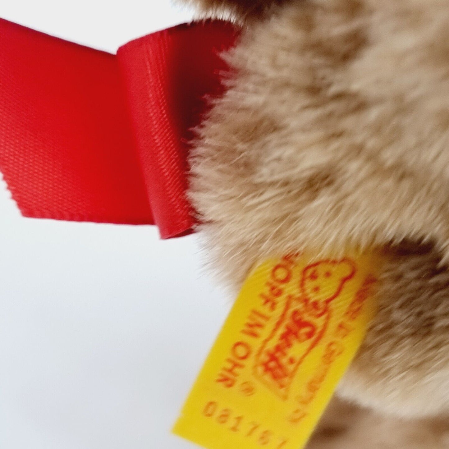 Steiff Hund Bernie 081767 16 cm braun mit roter Schleife
