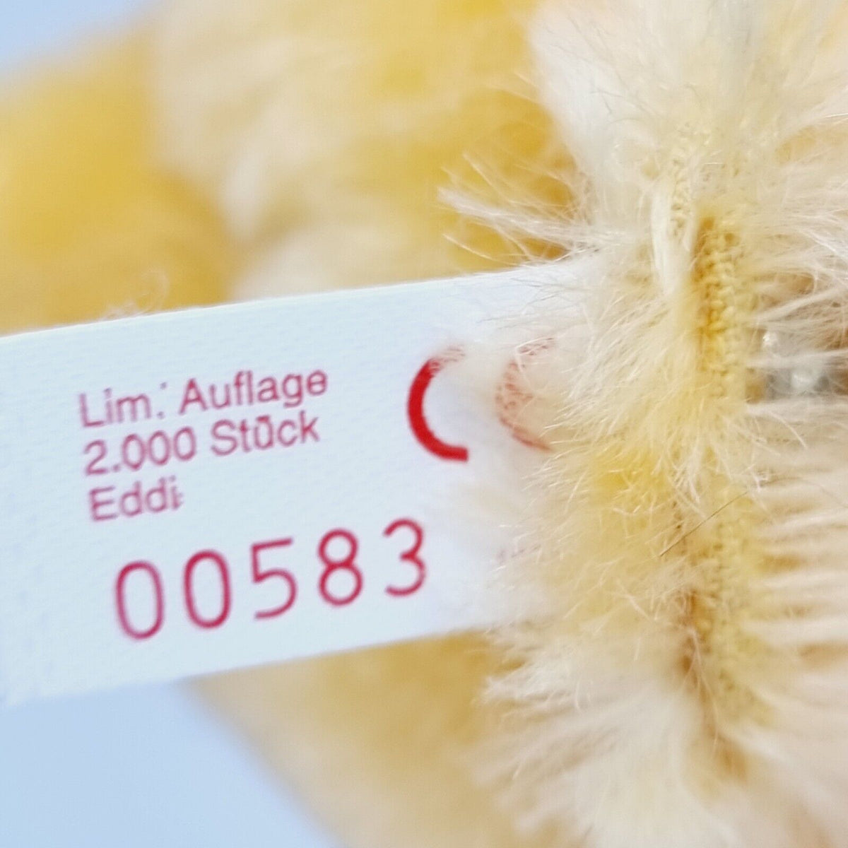 Steiff 650925 Teddybär Eddi Spiel und Spaß mit blauer Schleife
