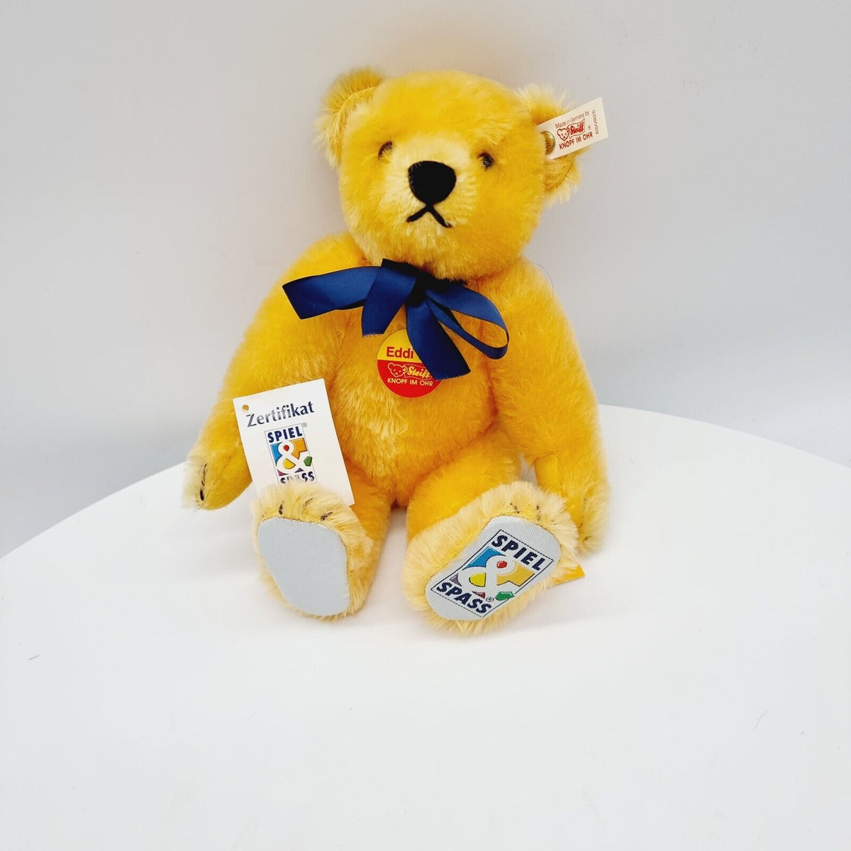 Steiff 650925 Teddybär Eddi Spiel und Spaß mit blauer Schleife