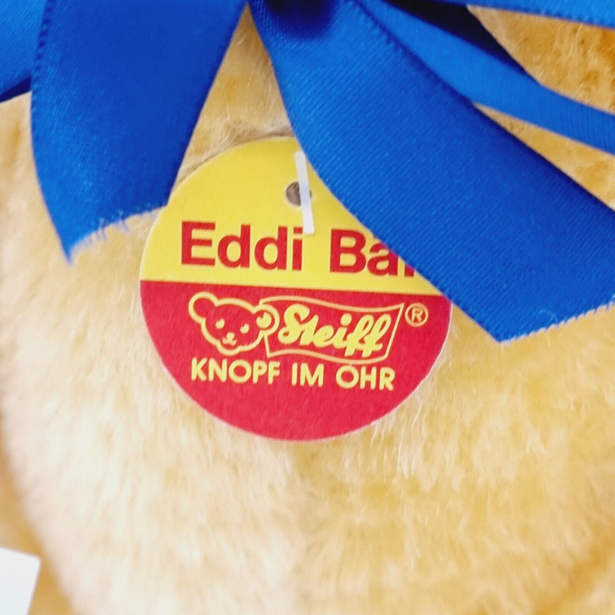 Steiff 650925 Teddybär Eddi Spiel und Spaß mit blauer Schleife